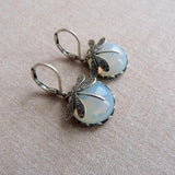 Boucles d'oreilles libellule argentées avec cristal blanc