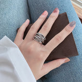 Bague ajustable argentée superposée