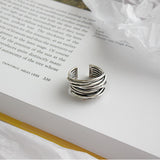 Bague ajustable argentée superposée